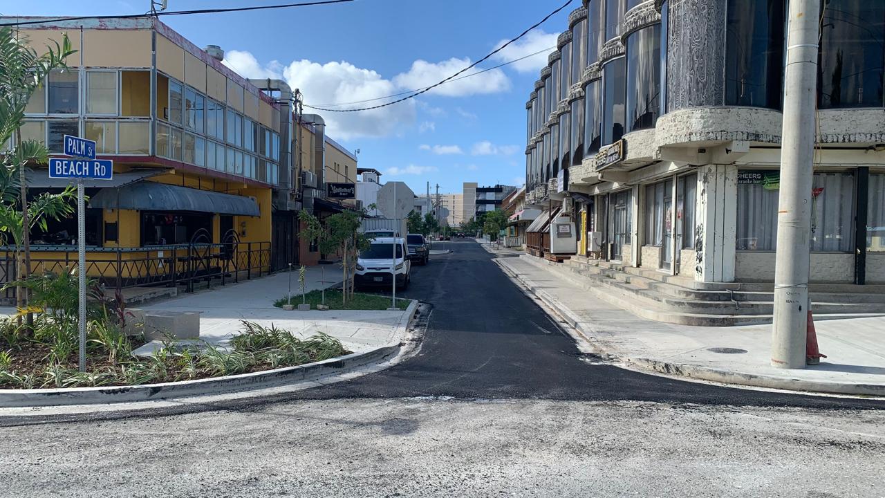 newly paved street between 2 buildings